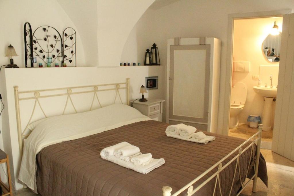Ένα ή περισσότερα κρεβάτια σε δωμάτιο στο Casa vacanze PetraCielo