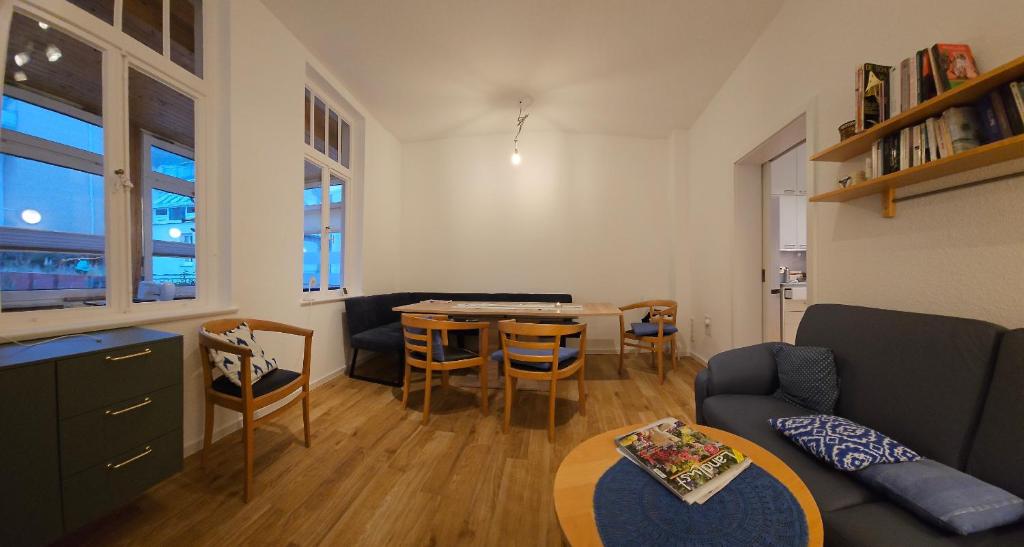 a living room with a couch and a table at Haus Wendland Haus Wendland in Norderney