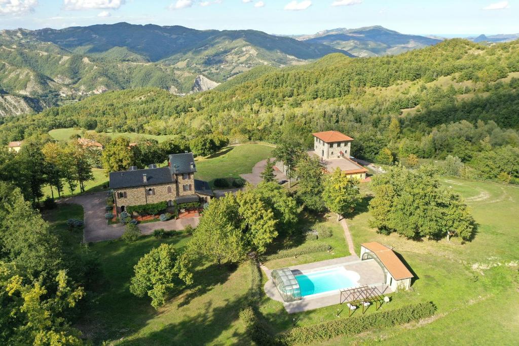 an aerial view of a estate with a swimming pool at Historic Villa In The Tuscan Woods And Hills in Casteldelci