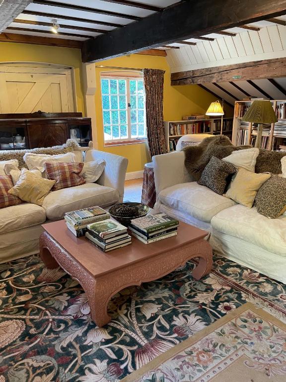a living room with couches and a coffee table at Bartley Mill in Wadhurst