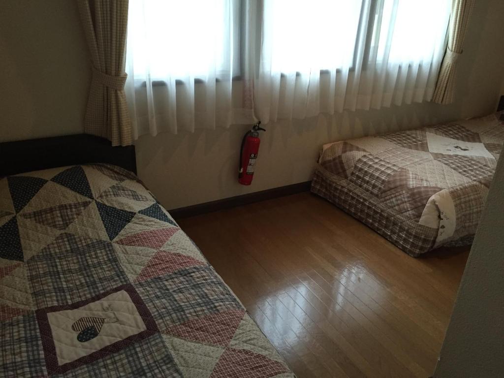 Postel nebo postele na pokoji v ubytování Cottage Morino Nakamatachi
