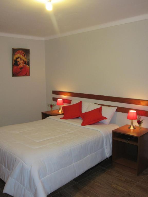 Postel nebo postele na pokoji v ubytování Cusco House