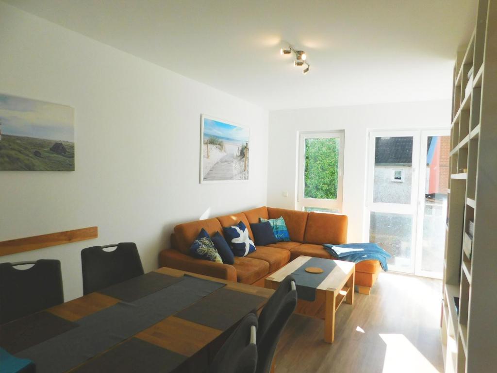 a living room with a couch and a table at FeWo "Hafenblick" in Barth