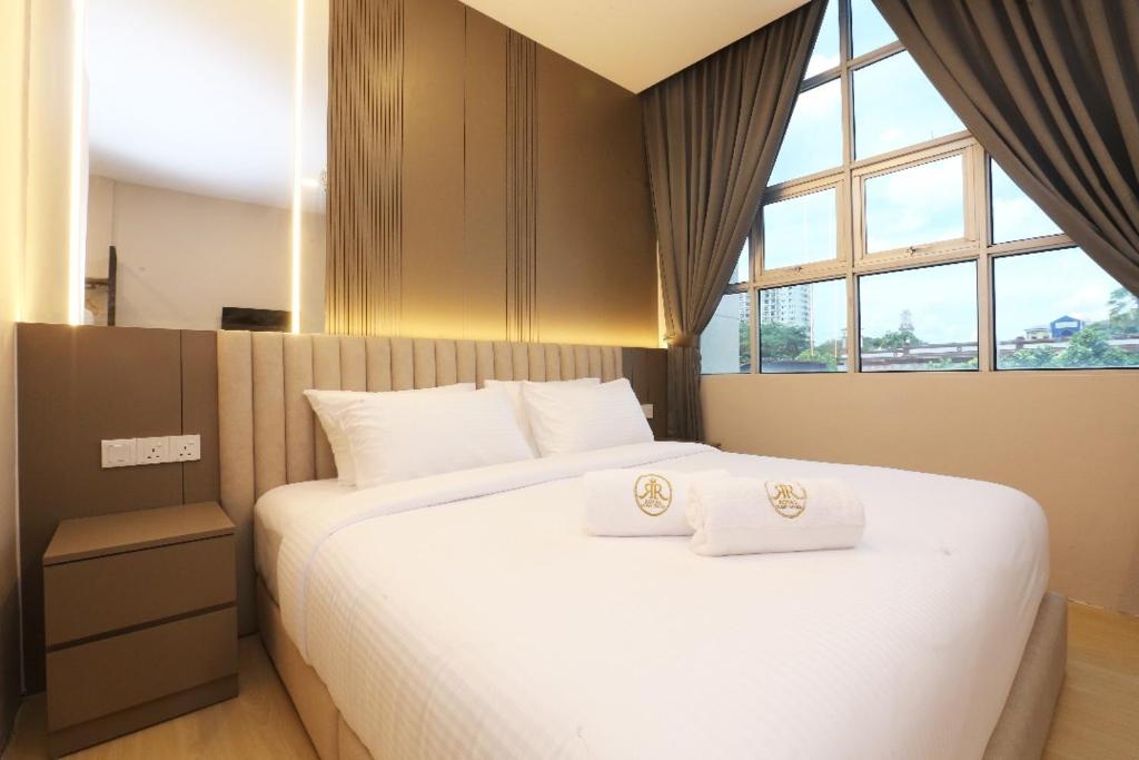 Ένα ή περισσότερα κρεβάτια σε δωμάτιο στο Royal Guest House RGH