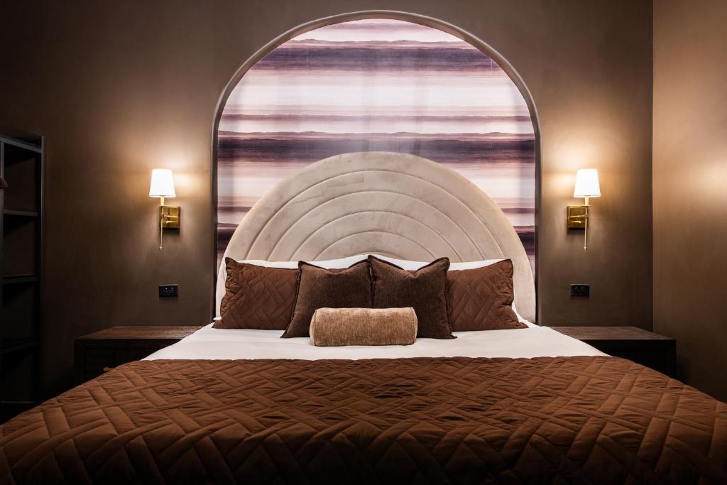 a bedroom with a large bed with a large window at Hollyhock Suite 512 in Louisville
