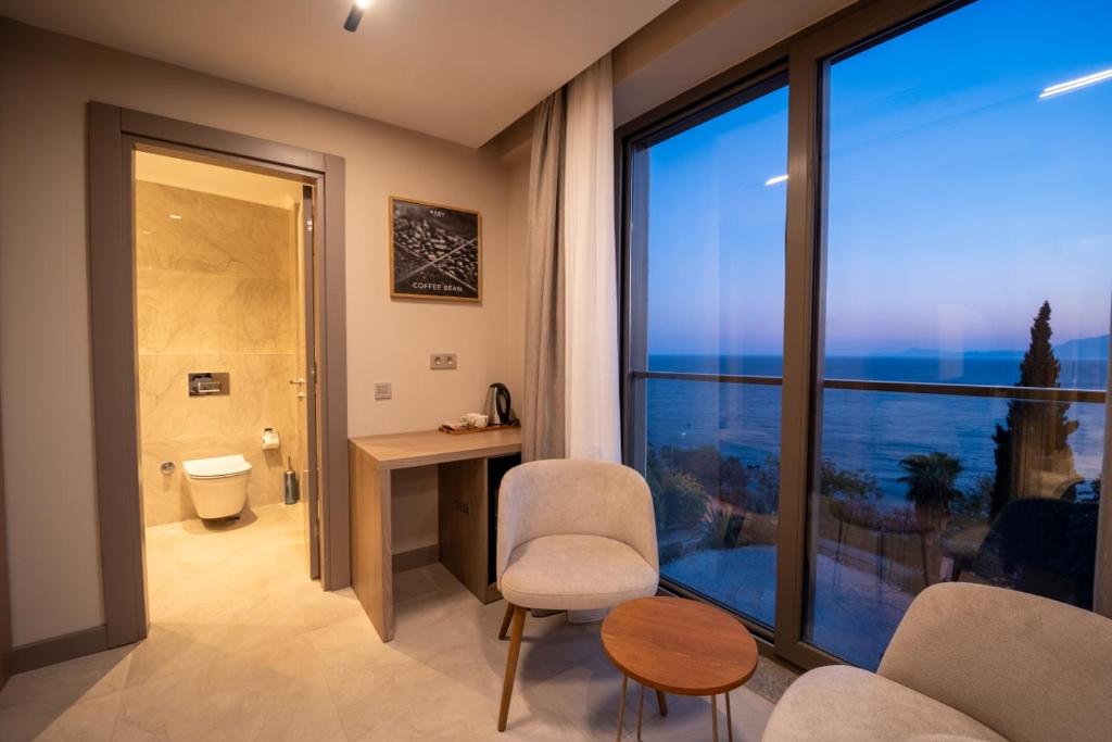 a bathroom with a room with a large window at Reev Coffee House in Antalya