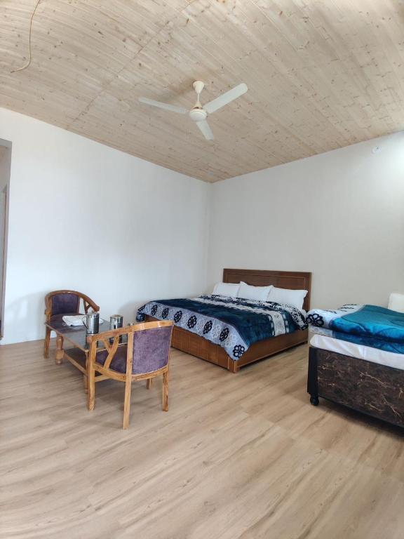 Ένα ή περισσότερα κρεβάτια σε δωμάτιο στο TTS Homestay