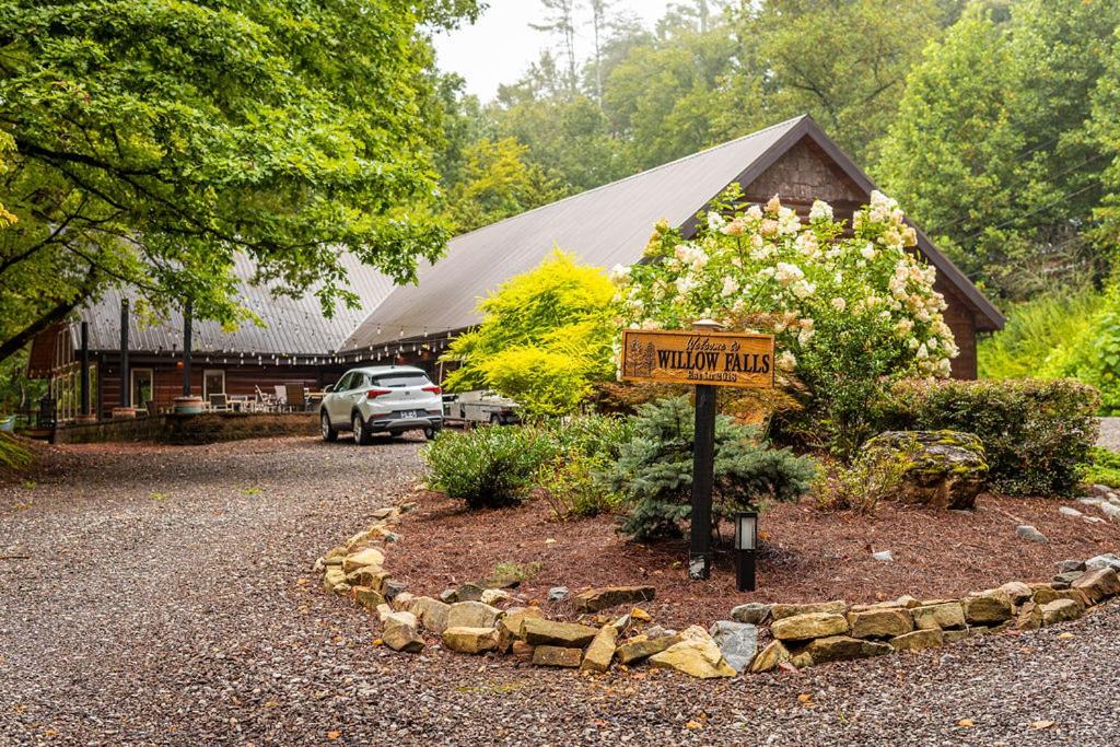 a sign in front of a building with a house at Willow Falls in Blue Ridge