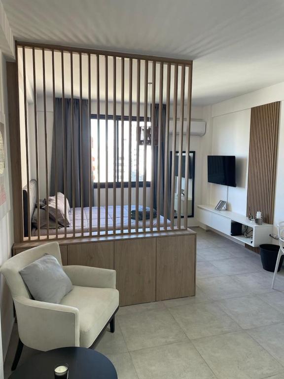 a large living room with a bed and a couch at Nordico II in La Plata