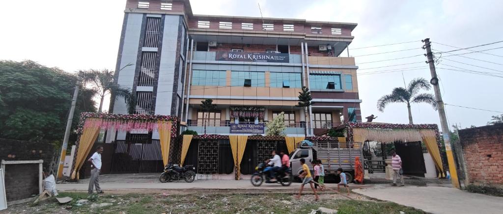 a building with people standing in front of it at Hotel Royal Krishna in Gorakhpur