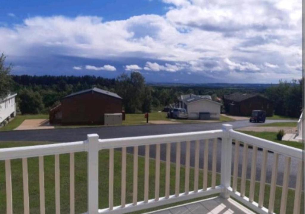 a view from the balcony of a house with a white fence at The View Point Northumberland in Newton on the Moor