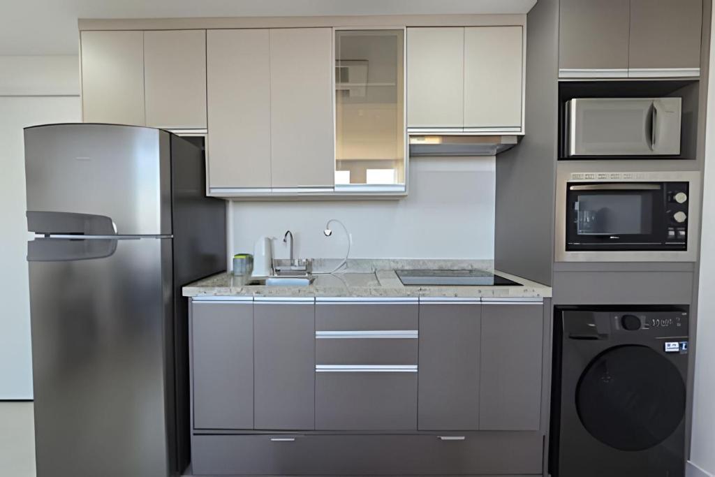 Η κουζίνα ή μικρή κουζίνα στο Apartamento ao lado do EZTower - com 1 vaga!
