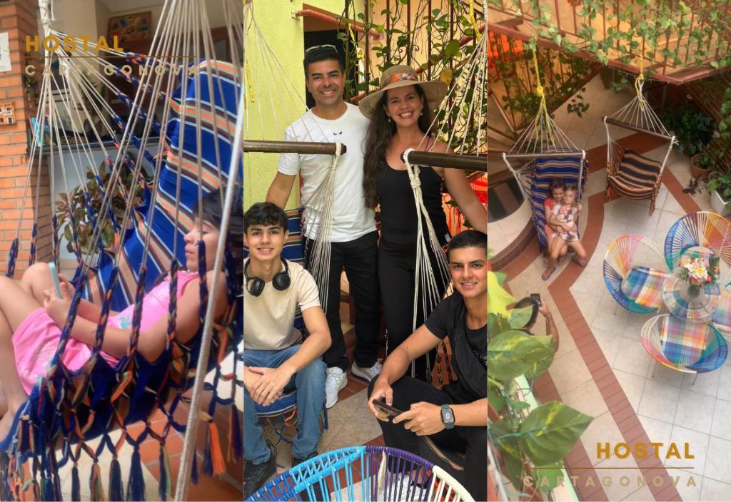 a family posing for a picture on a swing at Hostal Cartagonova - Habitaciones privadas y amplias cerca a zonas turísticas in Cartagena de Indias