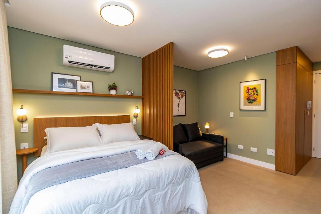 Ένα ή περισσότερα κρεβάτια σε δωμάτιο στο Studio Premium em Prédio com Piscina - BAT1814