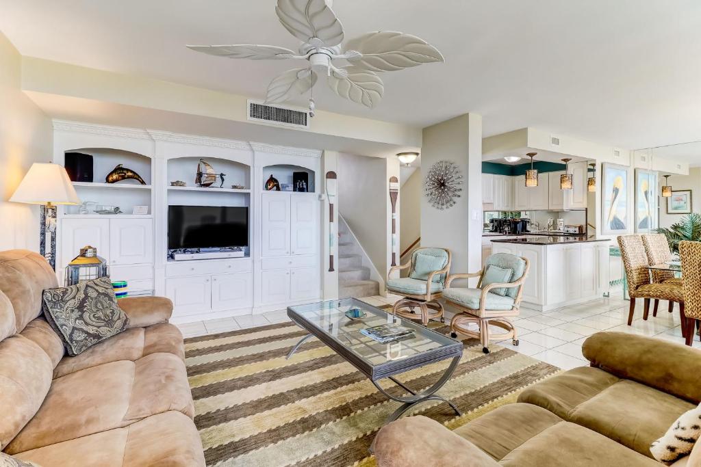a living room with a couch and a table at Oceanfront 3 Bedrooom BeachWalker Condo in Amelia Island