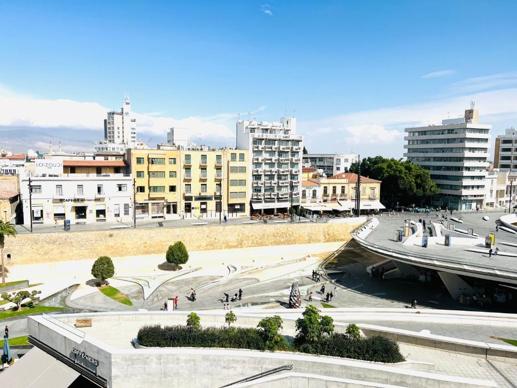 a view of a city with buildings at Plateia Suite Verde in Nicosia
