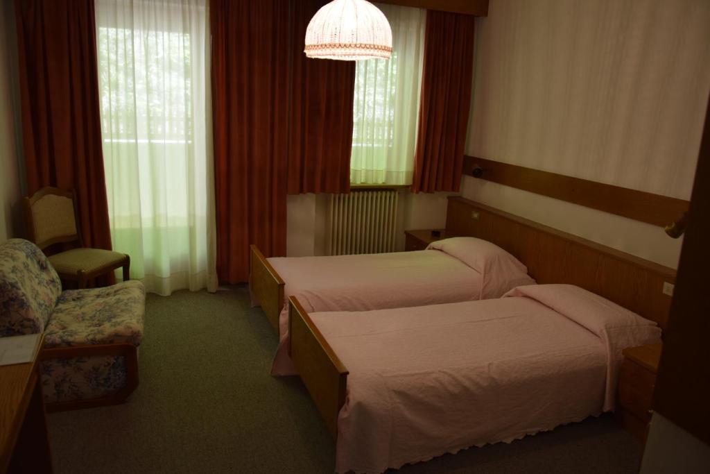 Postel nebo postele na pokoji v ubytování Hotel Alpenrose