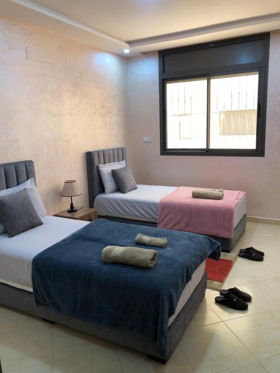 Ένα ή περισσότερα κρεβάτια σε δωμάτιο στο Appartement élégant près de la mer, avec superbe vue sur les montagnes