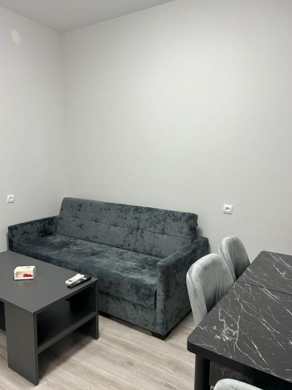 a living room with a couch and a table at Grigor's Guestgouse in Yerevan