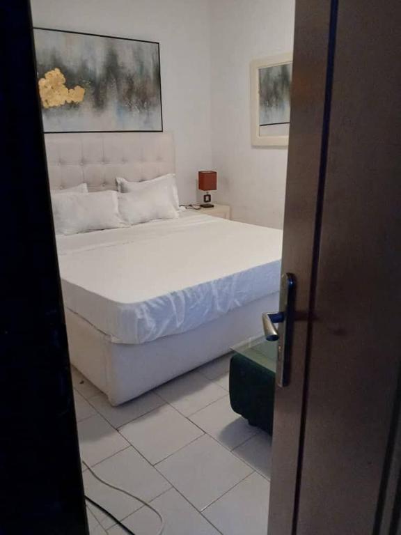 Ένα ή περισσότερα κρεβάτια σε δωμάτιο στο Chambre meublée