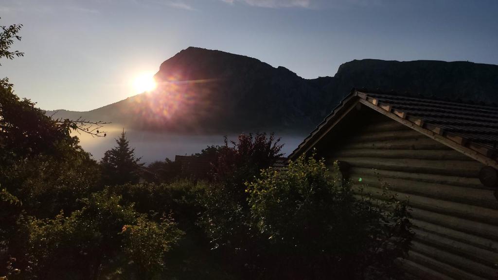 a view of the sun rising over a mountain at Jupiter in Rimetea