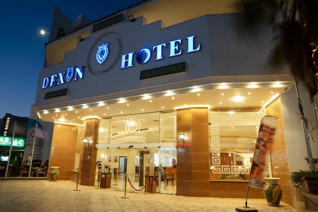 a hotel with a sign on the front of it at Dexon Roma All Inclusive Hotel in Hurghada
