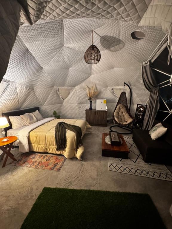 a bedroom with a bed and a person laying on it at Quinta Paco de Lucía in Yaruqui