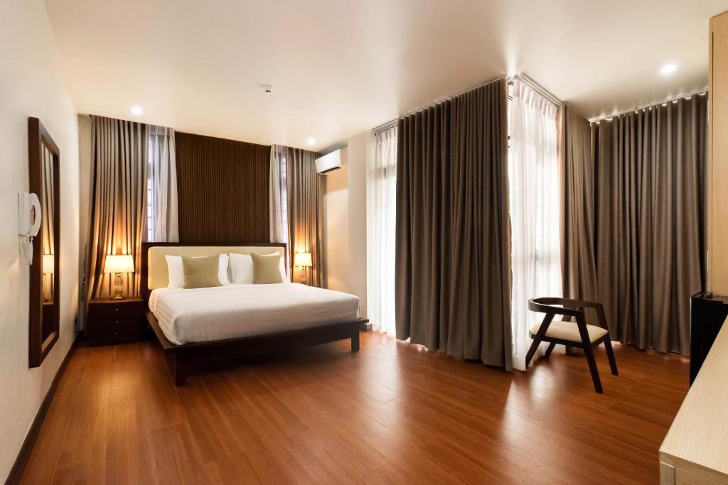 Postel nebo postele na pokoji v ubytování NandB HOTEL