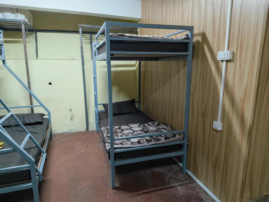 a bunk bed room with two bunk beds in it at Hills Vacation Hostel in Darjeeling