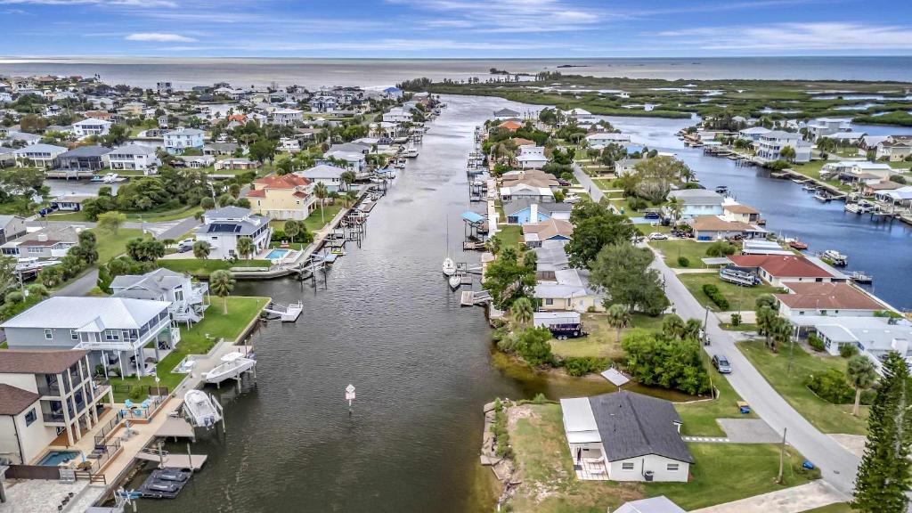 an aerial view of a town next to a river at Oyster House Waterfront 3b2b Kayaks BBQ Games in Hernando Beach