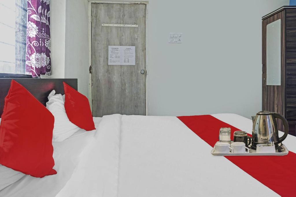 Postel nebo postele na pokoji v ubytování Hotel O R K Exclusive