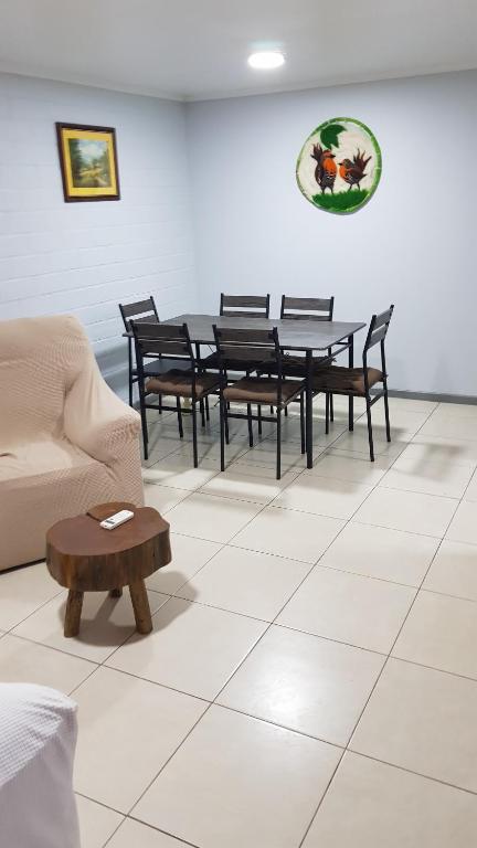 a living room with a table and chairs and a couch at Casa en Graneros in Graneros