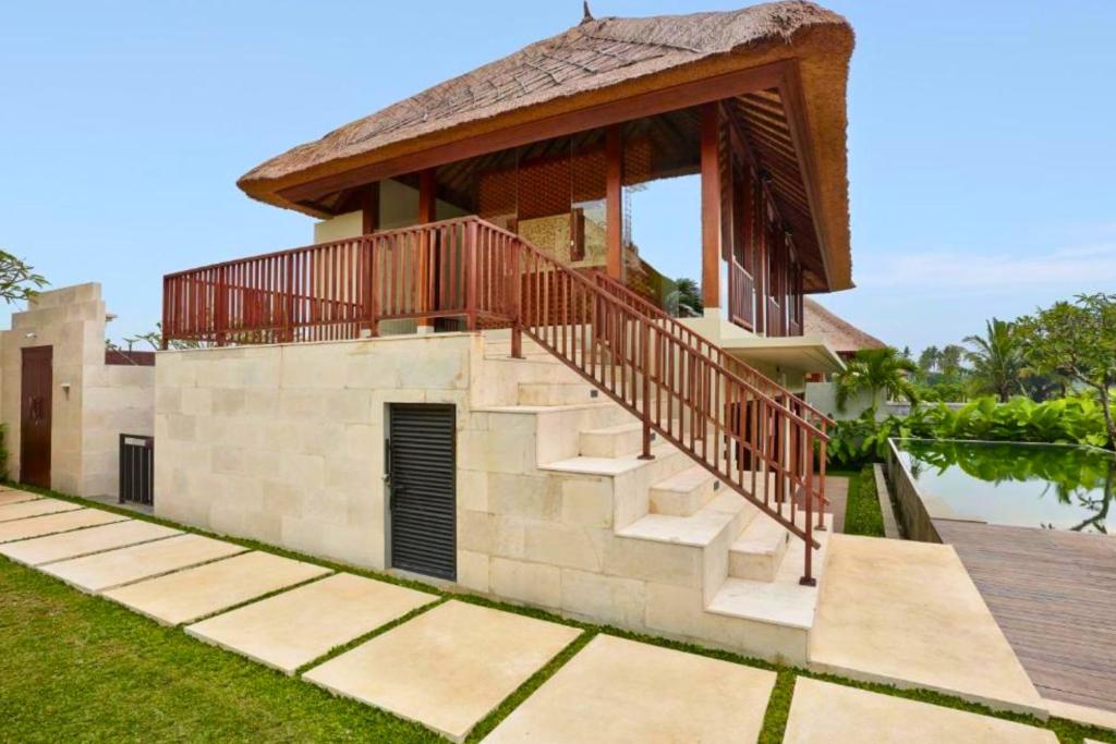a house with a deck on the side of it at Aitana 3 BR Private Pool Villa ZN286 in Blahbatu