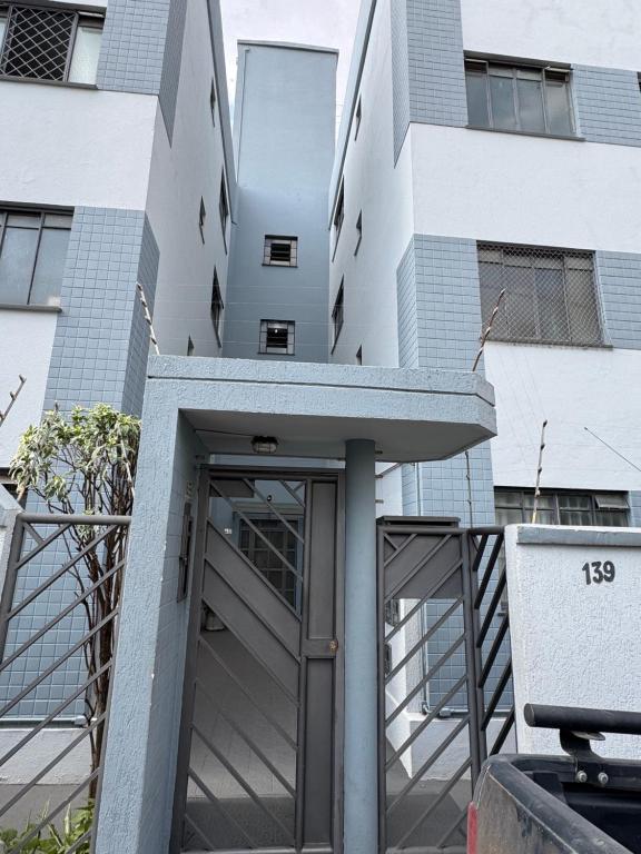 a building with a revolving door in front of it at Apartamento Residencial Alice in Uberaba
