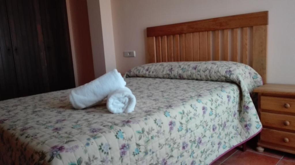 Postel nebo postele na pokoji v ubytování Hostal La Vega