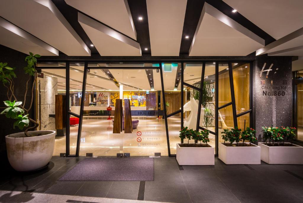 a store front with potted plants in a building at HOTEL HI- Chui-Yang in Chiayi City