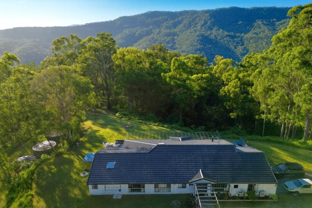 an aerial view of a house in the woods at Hinterland Heights in Canungra