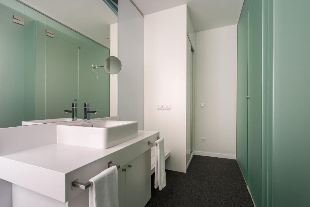 a bathroom with a sink and a mirror at Room Mate Oscar, Madrid in Madrid
