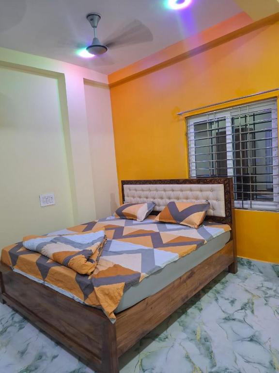 a bedroom with a large bed in a room at Sabitri Villa in Konārka