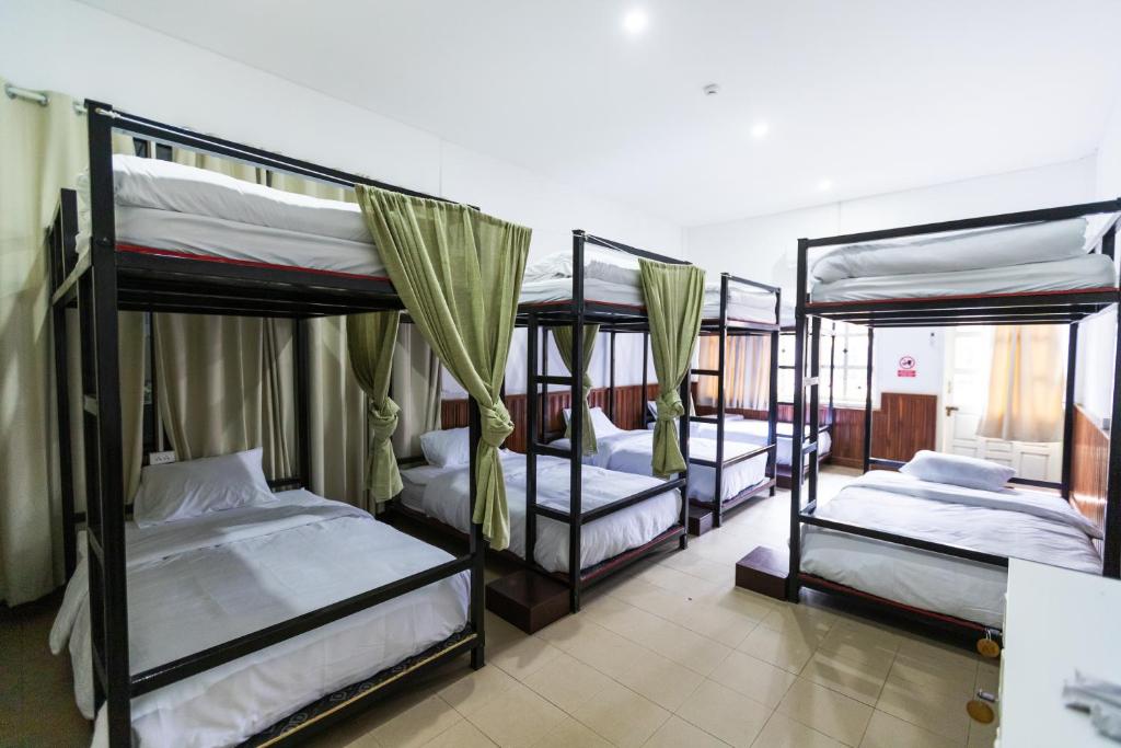 Ένα ή περισσότερα κρεβάτια σε δωμάτιο στο Nisa hostel