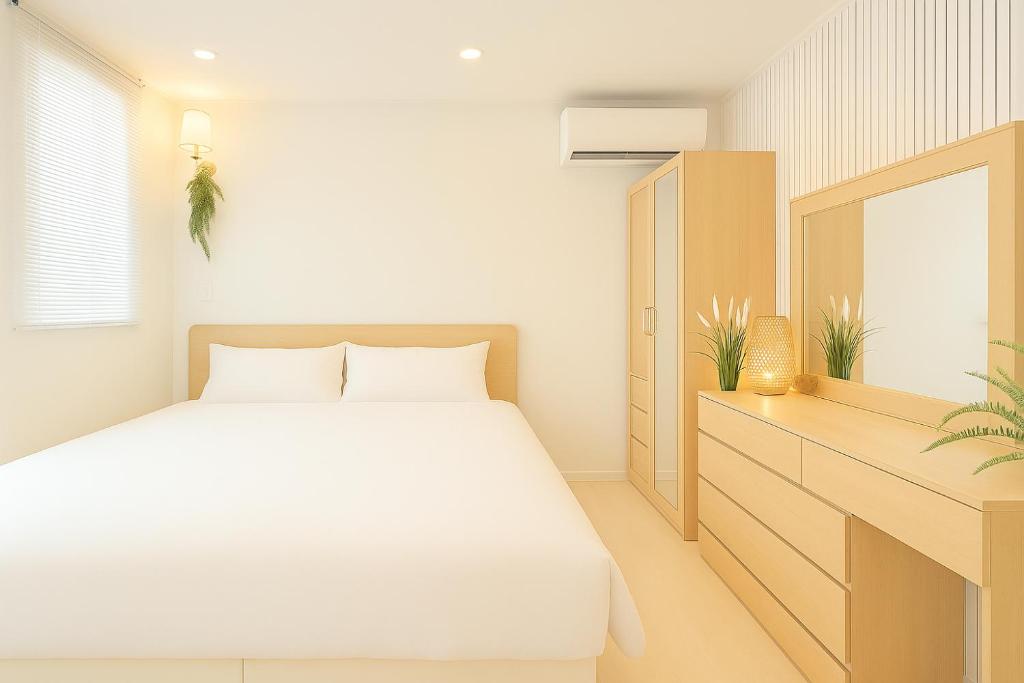 Postel nebo postele na pokoji v ubytování N Village