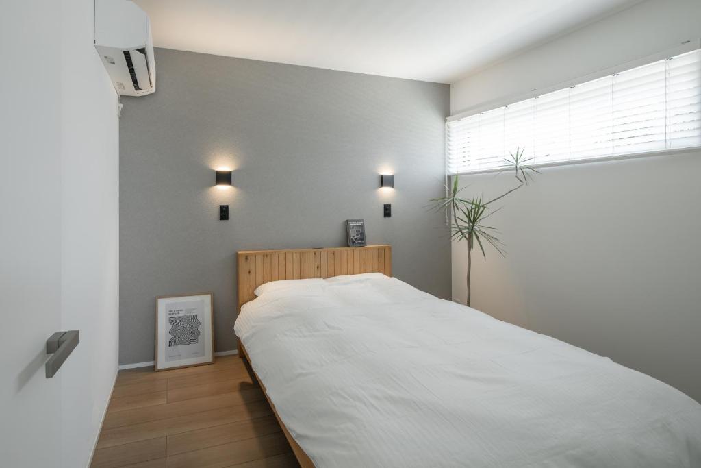 Ένα ή περισσότερα κρεβάτια σε δωμάτιο στο 暁の宿