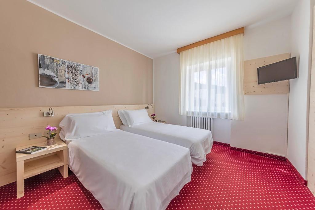Cama o camas de una habitación en Hotel Sorapiss