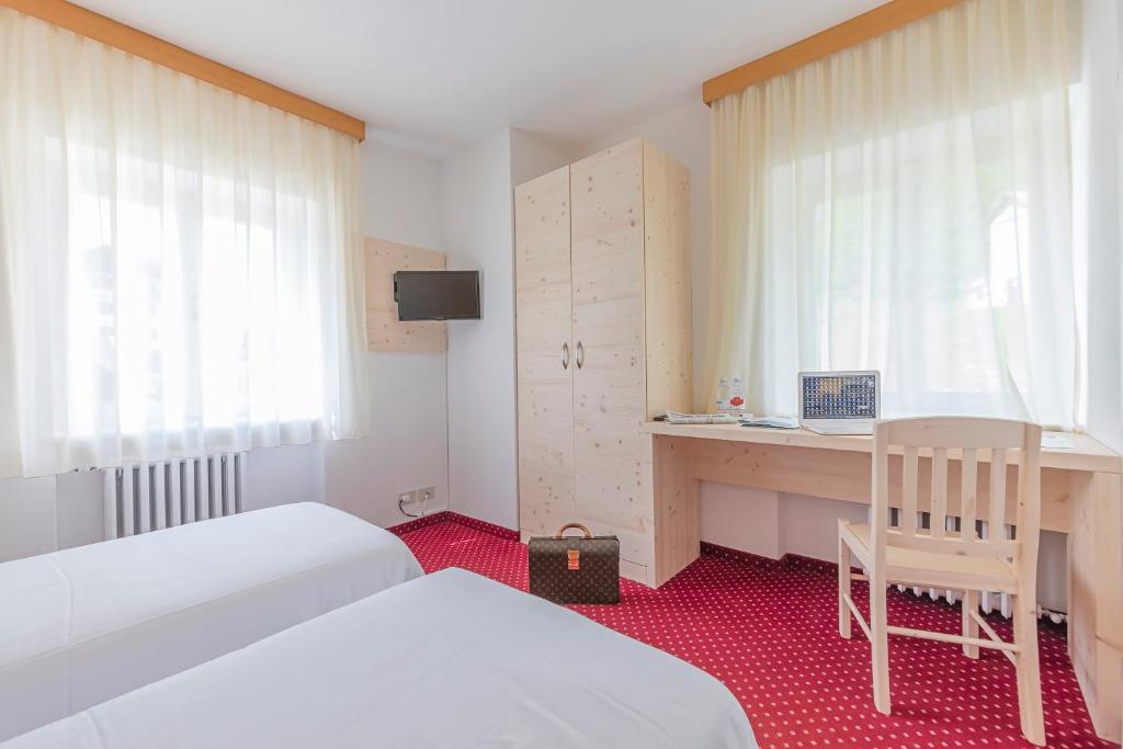 Cama o camas de una habitación en Hotel Sorapiss