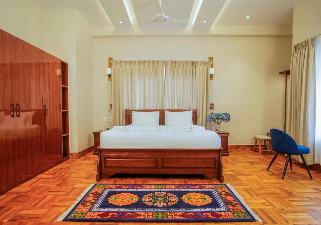 Postel nebo postele na pokoji v ubytování Khamsum Phuntsholing