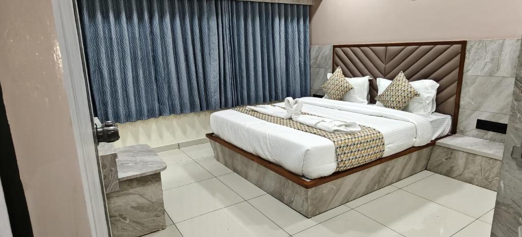 Ένα ή περισσότερα κρεβάτια σε δωμάτιο στο HOTELSunlight inn