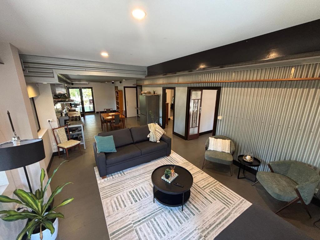 a living room with a couch and a table at 24 Elizabeth in Oxford Park
