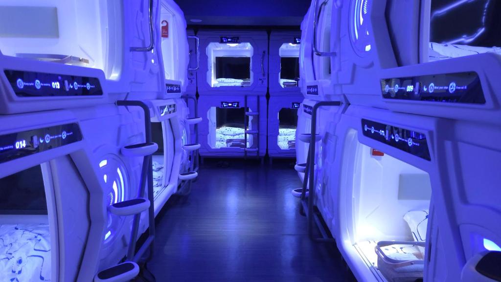 an inside view of an empty bus at Hotel Galaxy Pod 本川越店 in Kawagoe
