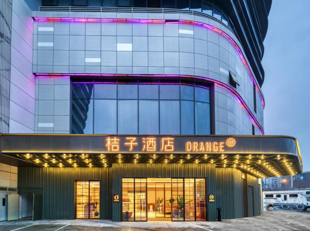 an office building with a sign that reads orange at Orange Hotel Hangzhou Songcheng in Hangzhou
