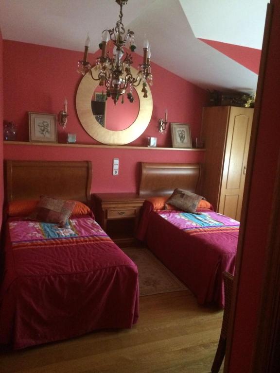 Postel nebo postele na pokoji v ubytování Hostal Monica